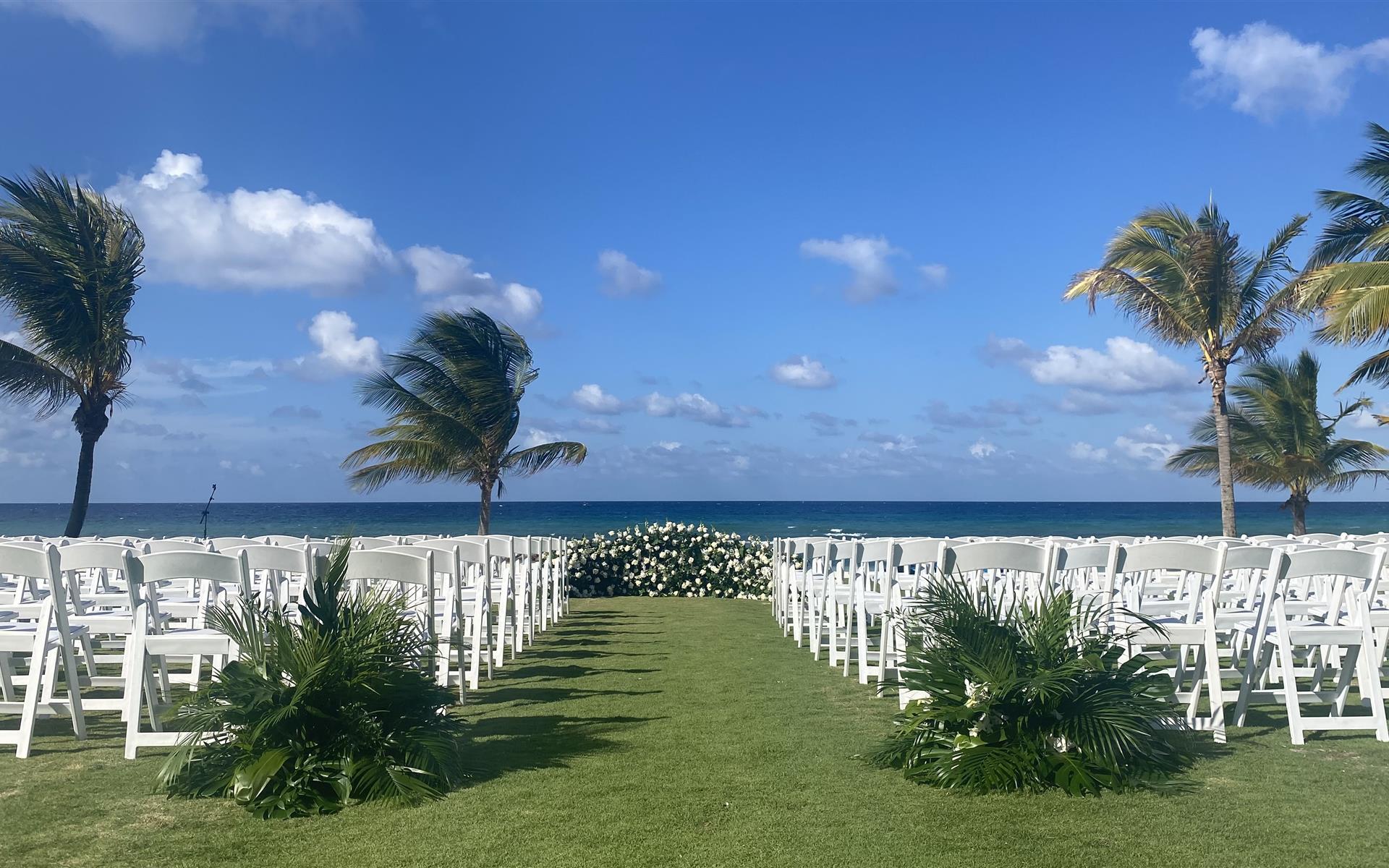 Outdoor wedding with fresh palm fronds