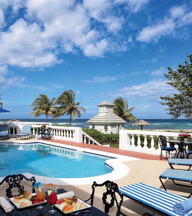 A pool with a table and chairs on it