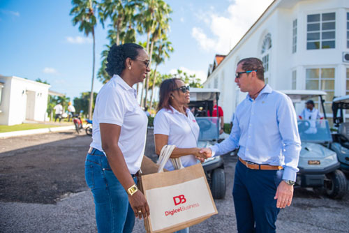 Digicel Business representatives shaking hands with a guy