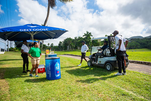 Grey Goose umbrella stand with alcoholic and nonalcoholic cold drinks