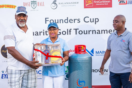 Golfer receiving a gift box of various liquors