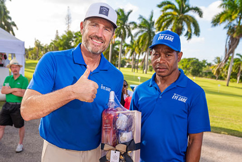 Professional Eye Care representatives smiling with a gift basket