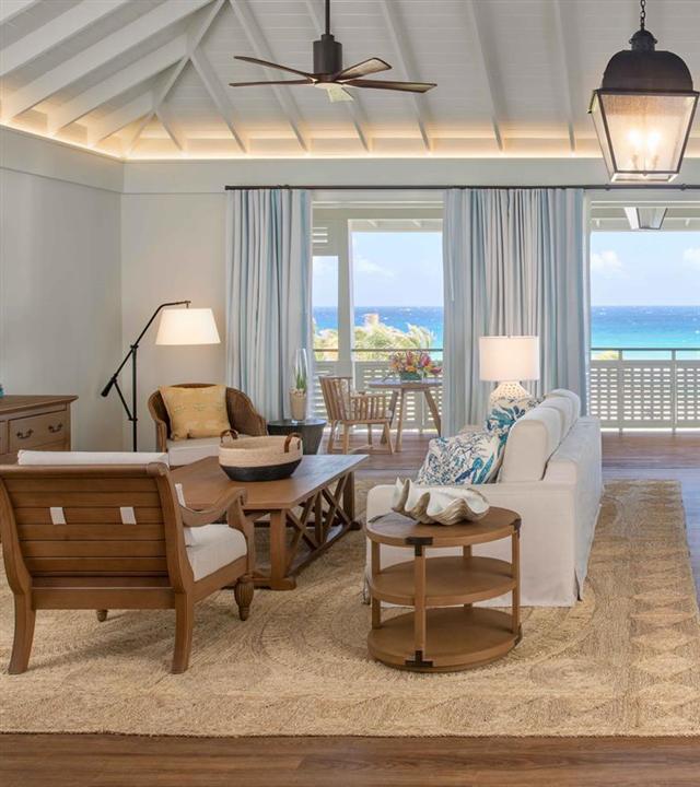 A living room with a large window and a couch