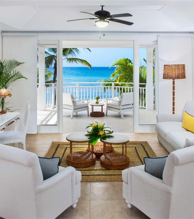 A living room with a view of the ocean