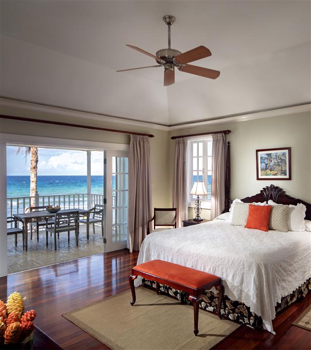 A bedroom with a view of the ocean