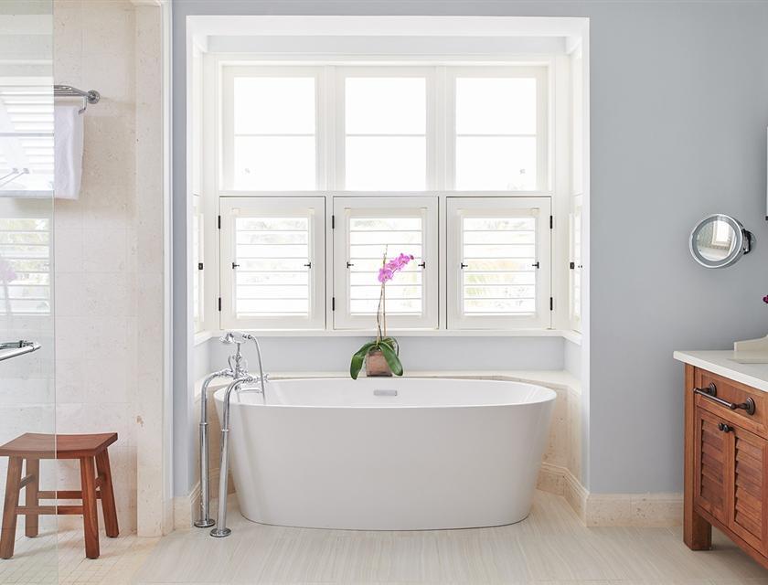 A bathroom with a tub and a sink