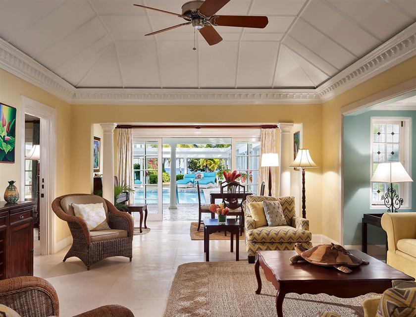 A living room with a fan and furniture