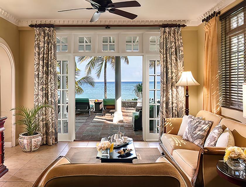 A living room with a view of the ocean