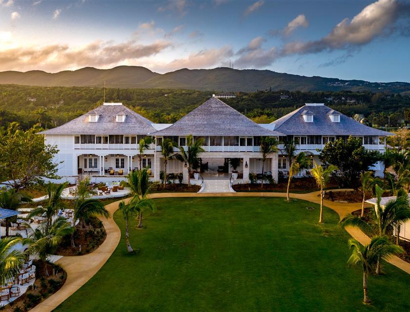 Resort view of green lawn at sunset