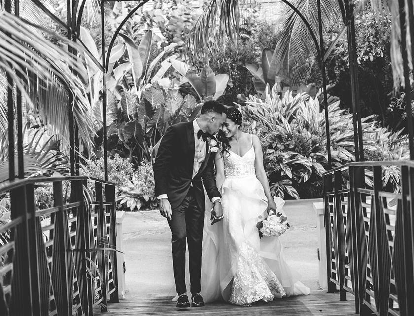 Couple smiling and laughing together in wedding attire